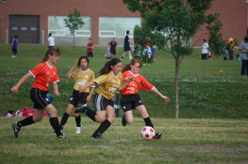 Angela playing soccer